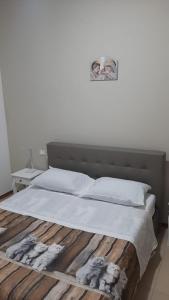 Een bed of bedden in een kamer bij CASA VACANZE LA SIRENETTA