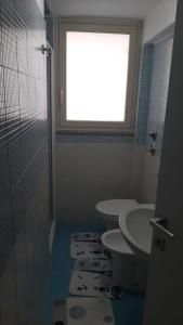 Een badkamer bij CASA VACANZE LA SIRENETTA