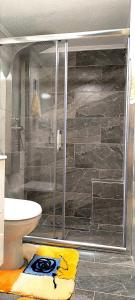 a bathroom with a shower with a glass door at Xanthi's House in Xanthi