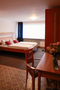 Postel nebo postele na pokoji v ubytování Hotel Kickert
