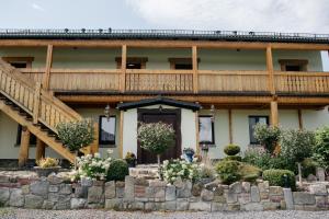 a large house with a wooden deck on top of it at Agroturystyka Natura in Pilchowice +47 photos