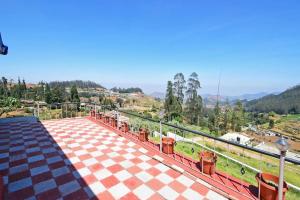 a view of a train station from the roof of a building at dreams cottage in Ooty