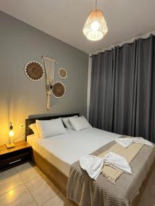 Posteľ alebo postele v izbe v ubytovaní Maya Suites Kallithea