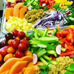 a tray filled with different types of fruits and vegetables at BiG Event AS in Grimstad