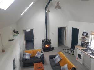 an overhead view of a living room with a fireplace at Beautiful 3-Bed House close to Ballybunion in Tralee