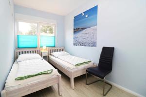 Ένα ή περισσότερα κρεβάτια σε δωμάτιο στο Ferienwohnung Wiesenglueck +10 φωτογραφίες