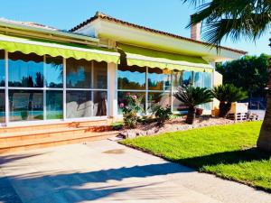 a house with large windows and a porch at Chalet La Calma en Lorca in Lorca +33 photos