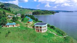 an aerial view of a house on an island in a lake at Nyamunyonyi Tourism Resort in Kabale