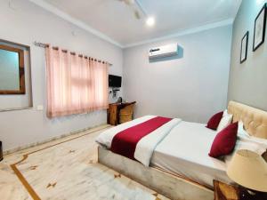 Voodi või voodid majutusasutuse The Boho Udaipur toas