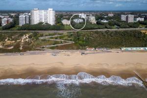 an aerial view of a beach with tall buildings at Bournecoast - Brand New Clifftop Apartment with Balcony - FM9574 in Bournemouth