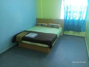 Krevet ili kreveti u jedinici u objektu OYO 90471 Hotel Tepoh