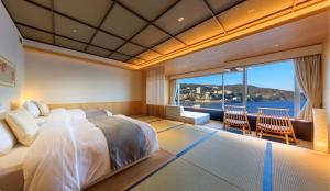 Postelja oz. postelje v sobi nastanitve Atami Korakuen Hotel