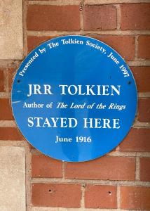 a blue sign on a brick wall at Best Western Plough and Harrow Hotel in Birmingham