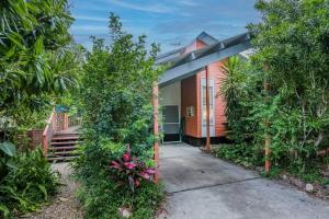 a house with a pathway leading to the entrance at Beach home in the heart of Agnes in Agnes Water