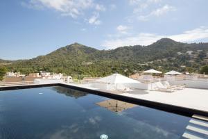 a swimming pool with a view of the mountains at Canyamel Park Hotel & Spa - 4* Sup - Adults only (+16) in Canyamel
