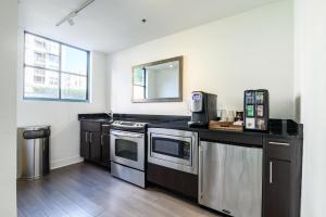 a kitchen with stainless steel appliances and a counter top at South Beach 2br w tennis nr public transport SFO-1663 in San Francisco
