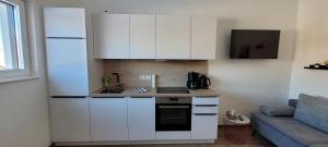 Kuchyň nebo kuchyňský kout v ubytování Appartement Petersberg