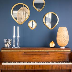 a piano against a blue wall with mirrors at Pleasant Family house with swimming pool in Bordeaux