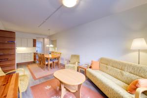 a living room with a couch and a table at Tampereen kunkku in Tampere