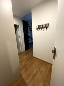a room with a white door and a wooden floor at Kramare 303 in Bratislava