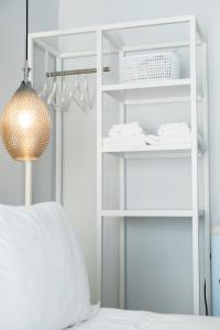 Postel nebo postele na pokoji v ubytování DIIO Suites