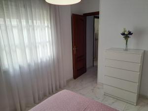 Postel nebo postele na pokoji v ubytování APARTAMENTO SAN ANDRÉS TORRE DEL MAR