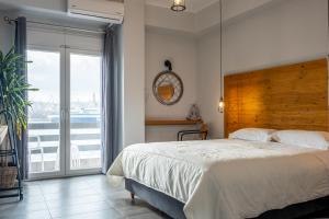 Postel nebo postele na pokoji v ubytování DIIO Suites