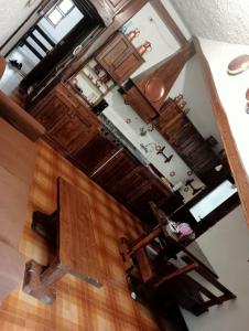 an overhead view of a kitchen with wooden cabinets at Tosa Inn in Miroglio
