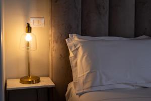 Bastione Spasimo Boutique Hotel客房内的一张或多张床位