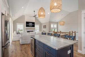 a kitchen and living room with a large counter top at LS14 Shelly Shores in Nags Head