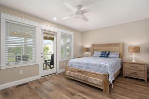 a bedroom with a bed and a ceiling fan at LS14 Shelly Shores in Nags Head