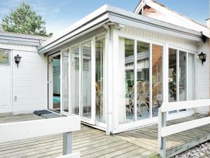 a screened in porch of a house at 6 person holiday home in Hemmet in Hemmet