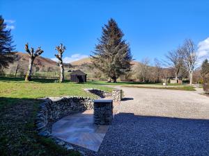 a stone path with a stone pillar in a park at Holiday Cottage 7 in Watermillock