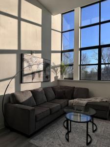 a living room with a couch and a table at MEB Loft in Darby