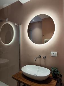 a bathroom with a sink and a mirror at CivitaNave in Civitanova Marche