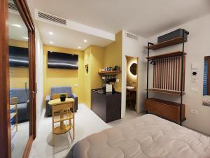 a bedroom with a bed and a desk and a chair at CivitaNave in Civitanova Marche