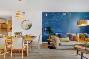 a living room with a couch and a table at Infinite Views, Amazing Pool, Gym, Near Beach in Hallandale Beach +47 photos