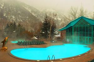 a large swimming pool in front of a building at ТАУ-HOUSE in Kok-Shoky
