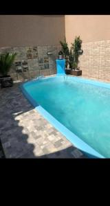 Πισίνα στο ή κοντά στο Aluga-se casa com piscina