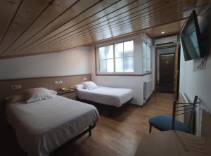 Łóżko lub łóżka w pokoju w obiekcie Hotel Hórreo by Bossh! Hotels