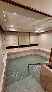 a large jacuzzi tub in a house at Unit 551,Privately Owned, Superior Room At the Forest Lodge Camp John Hay, Mountain View, 2 Double Beds in Baguio