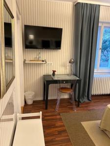 TV a/nebo společenská místnost v ubytování Villa Böhme