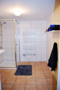 a bathroom with a shower and a sink at Haus Amsel in Niebüll