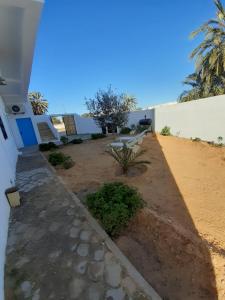 a walkway in front of a house at CoZi Coliving space Djerba in Mezraya