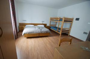 Postel nebo postele na pokoji v ubytování Hotel Sciatori + 16 fotografií