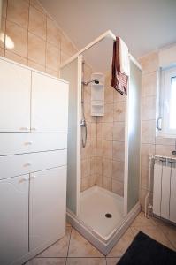 a bathroom with a shower with a walk in shower at Apartment Anita in Pula