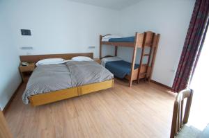 Postel nebo postele na pokoji v ubytování Hotel Sciatori