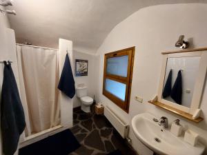 a bathroom with a sink and a toilet at Cala Clareta in Castellfollit de la Roca