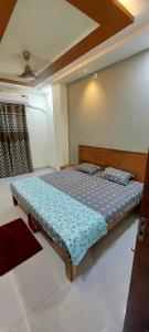 a bedroom with a bed in a room at Anant home stay in Ujjain
