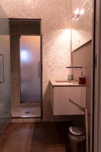 a bathroom with a shower and a sink at Regina Margherita Home in Rome